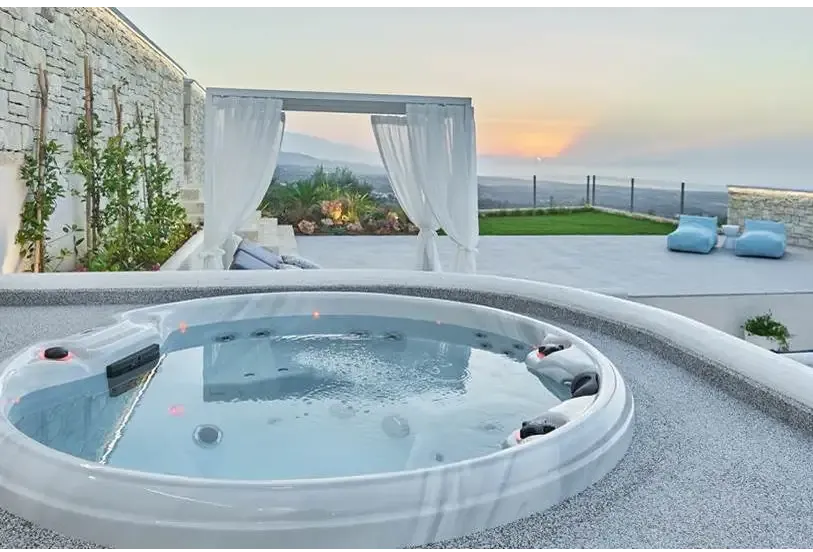PassionSpa Recharge Whirlpool – Pure Collection, weiße Ausführung, runde Form, Massagedüsen, rote Akzente