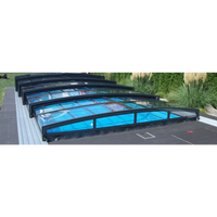 Pooltaket Special med RAL7016 antracit profiler, svart ramad glastak med valvdesign